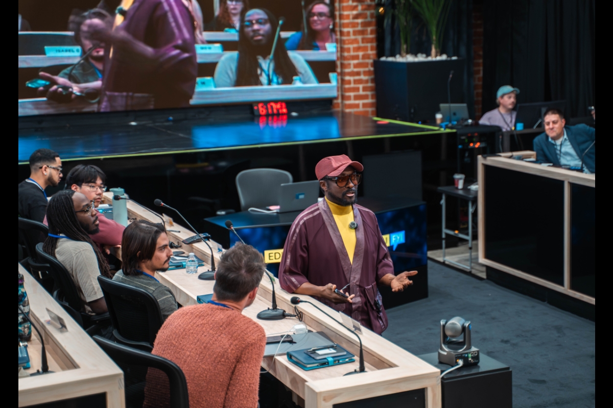will.i.am teaches in front of a room of students